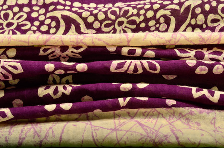 Graphic print with flowers and dots on crumpled background.の写真素材