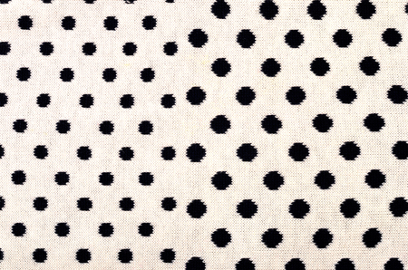 Closeup on white wool with black dots wool texture.の写真素材