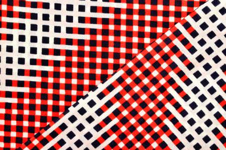 Red, white and blue checked print as background.の写真素材