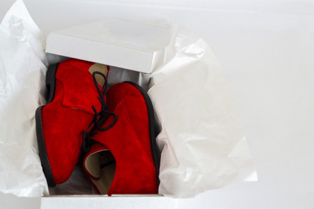 A pair of shoes in a boxの写真素材