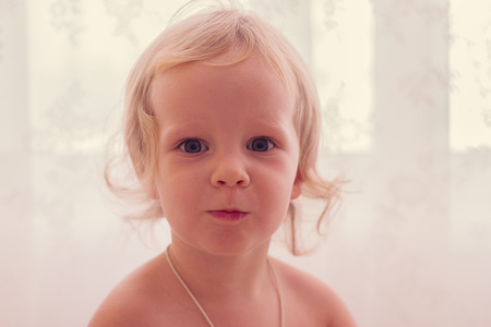 Cute funny little girl (2 years). Selective focus.の写真素材