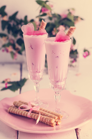 Strawberry ice cream with ice in the shape of a heart in glasses. Selective focus.の写真素材