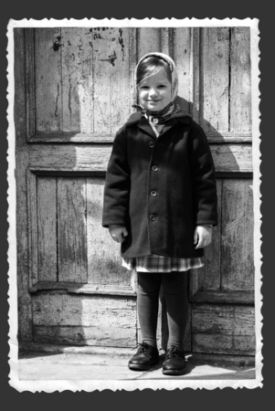 Photo in retro style. Cute little girl in a kerchief. Selective focus.の写真素材
