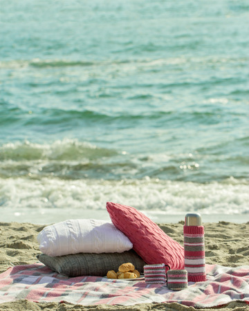 Breakfast on the beach. Coffee and croissants on the sea.の写真素材