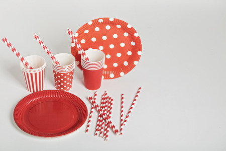 Red disposable tableware for parties and picnics. Selective focus.の写真素材