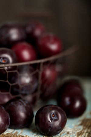 Ripe plums on a dark background. Macro photo. Selective focus.の写真素材