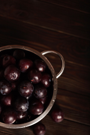 Ripe plums on a dark background. Macro photo. Selective focus.の写真素材