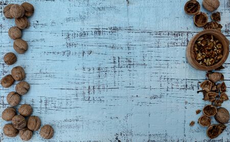 Walnuts on an old wooden background of blue color. Selective focus.の写真素材