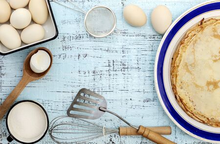 Cooking pancakes. Ingredients, crockery and kitchenware for pancakes. Selective focus.