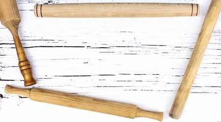 Vintage old kitchen utensils on a white woodenの写真素材