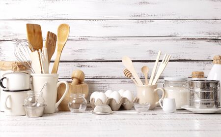Baking kitchenware and baking products on white wooden