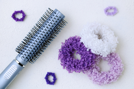 Scrunchy for hair large and small with comb on white rough backgroundの写真素材