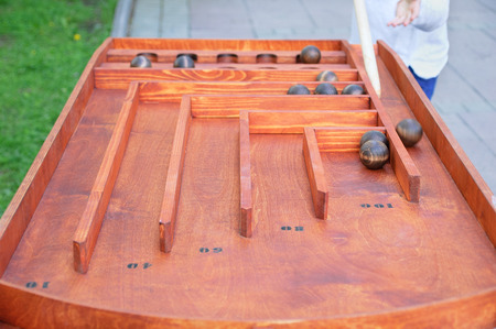 Playing metal balls on the table. Close-up.