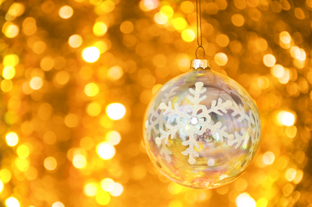 Christmas glass ball on bokeh background.の写真素材