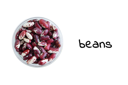 Red beans in a glass bowl. View from above. White isolate