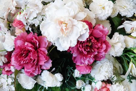 Floral background. Bouquet of flowers from roses, carnations and peonies close-up.