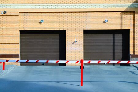 Automatic garage door. Entrance to the parking building.