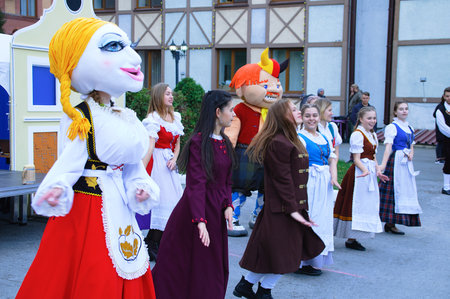 Russia 10-04-2019. Open event in the Russian-German house. Dancing in national costumes in the open air close-up.のeditorial素材