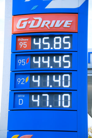 Russia 09-25-2019. Close-up electronic blue display with gas prices at a gas stationのeditorial素材