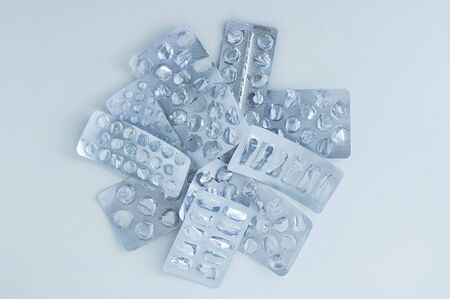 Empty silver packaging for medicines, pills on a white background.の写真素材
