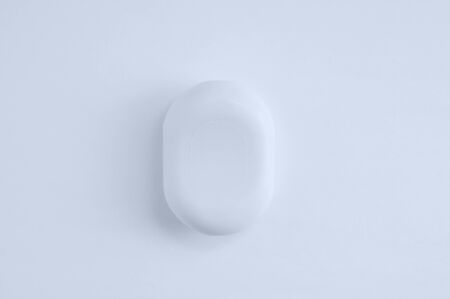 Closeup a bar of soap on a white background. View from above.