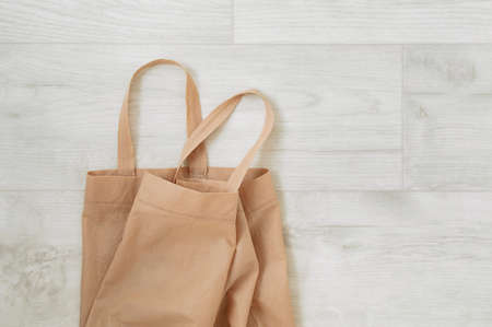 Zero waste concept. Brown cotton bag on gray wooden boards.の写真素材