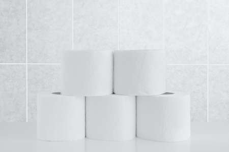 Rolls of toilet paper on a tile background.の写真素材