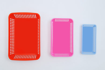 Three plastic boxes for the household on a white background. View from above.の写真素材