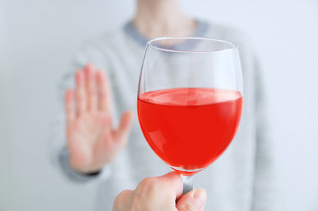 Alcohol rejection concept. Glass of wine close up.の写真素材