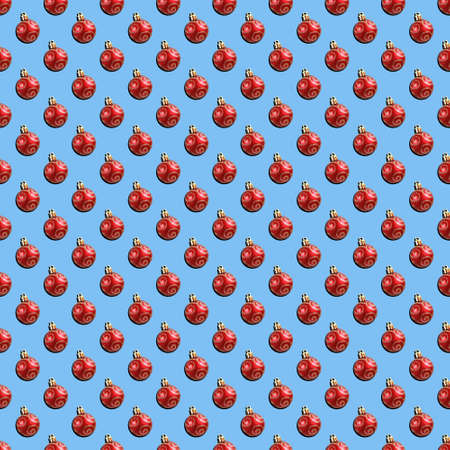 Red Christmas balls on a blue background. Seamless patterns.の写真素材
