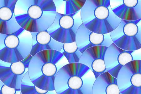 Blue compact discs close-up on a white background.