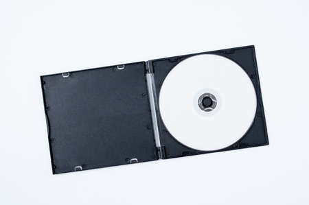 White CD in a black plastic box. white background.の写真素材