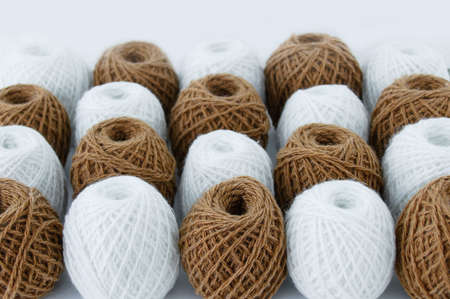 Brown and white skeins of wool close-up. selective focus.