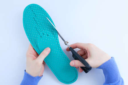 The insole for footwear is dimensionless. cuts with scissors. white background.