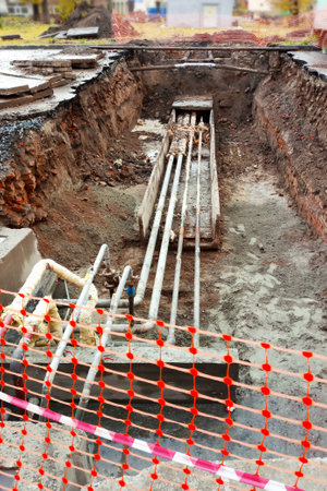 Repair of plumbing communications on the street in the city.の写真素材
