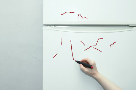 Painted refrigerator. Marker strokes. Marker in the child's hand.の写真素材