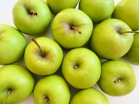 Green apples are slightly more sour than red apples.の写真素材