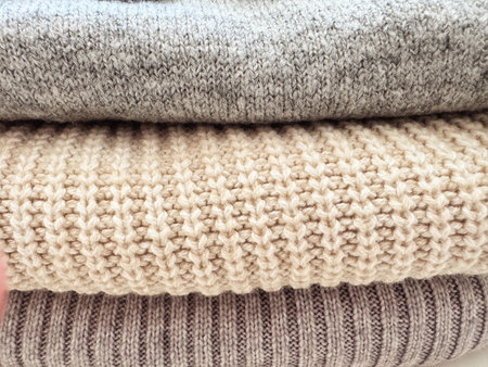 Autumn knitwear, stack of knitted folded clothing.の写真素材