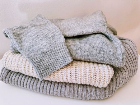 Autumn knitwear, stack of knitted folded clothing.の写真素材
