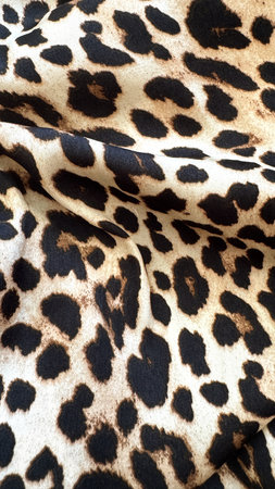 Classic Leopard Pattern on Soft Golden Brown Backgroundの写真素材