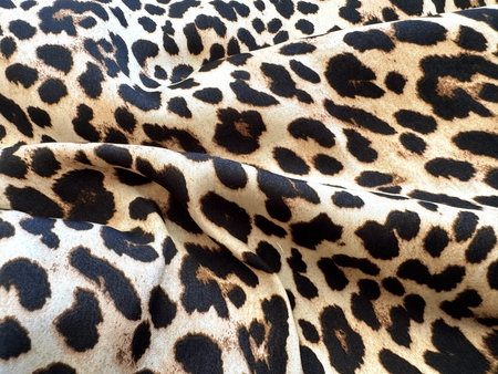 Classic Leopard Pattern on Soft Golden Brown Backgroundの写真素材