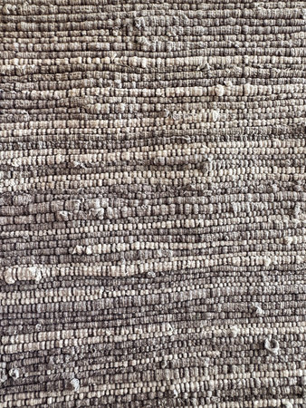 Handwoven recycled fabric rug made from upcycled textile scrapsの写真素材