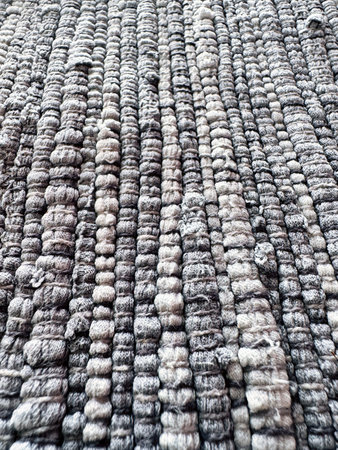 Handwoven recycled fabric rug made from upcycled textile scrapsの写真素材