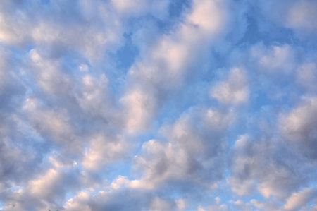 beautiful sunny blue sky with lots of large fluffy white clouds. Wonderful summer backgroundの写真素材