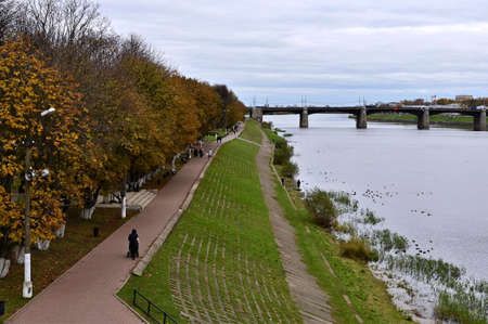 Beautiful city landscape with  view of river, bridge over it and embankment with autumn yellow trees. Concept of tourism. Tver. Russiaの写真素材
