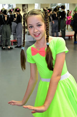 beautiful girl is rehearsing in dance class, preparing to perform on stage. Festive moodの写真素材