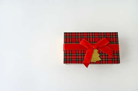 gift box tied with a red ribbon with a bow on a white background. Top view. Copy spaceの写真素材