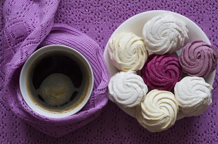 colored zephyr with a cup of coffee on the purple backgroundの写真素材