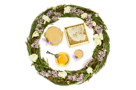 Breakfast with honey and herbs on white background