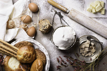 Baking ingredients - flour, butter, eggs, sugar. Baked flour-based food: bread, cookies, cakes,...
